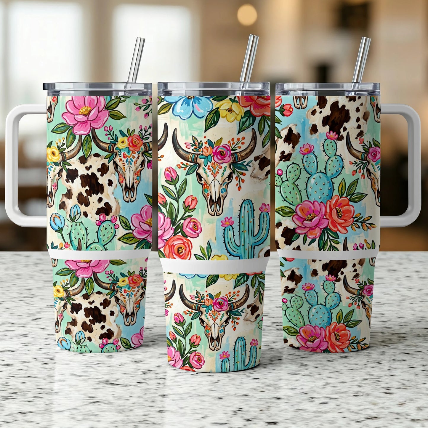 Three tumblers with cowhide, floral, cactus, and bull skull patterns.