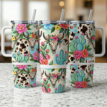 Three tumblers with cowhide, floral, cactus, and bull skull patterns.