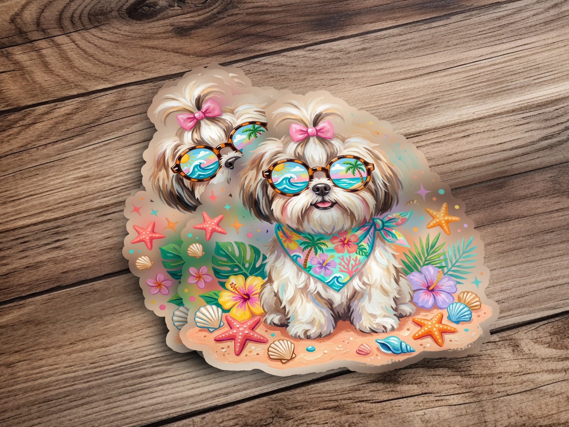 Two Shih Tzu dogs wearing sunglasses and bandanas on a beach with seashells.