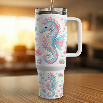 White tumbler with colorful seahorses, shells, and flowers design.