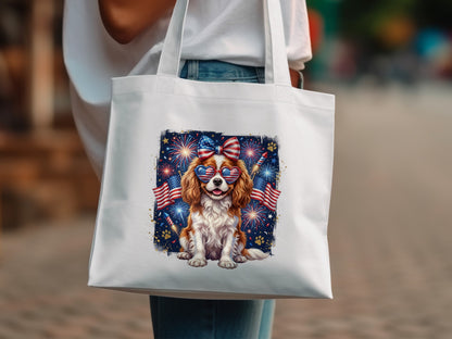 Dog wearing heart-shaped sunglasses with American flags and fireworks on a white tote bag.