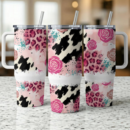 Three tumblers with pink leopard print, floral, and cow print designs.