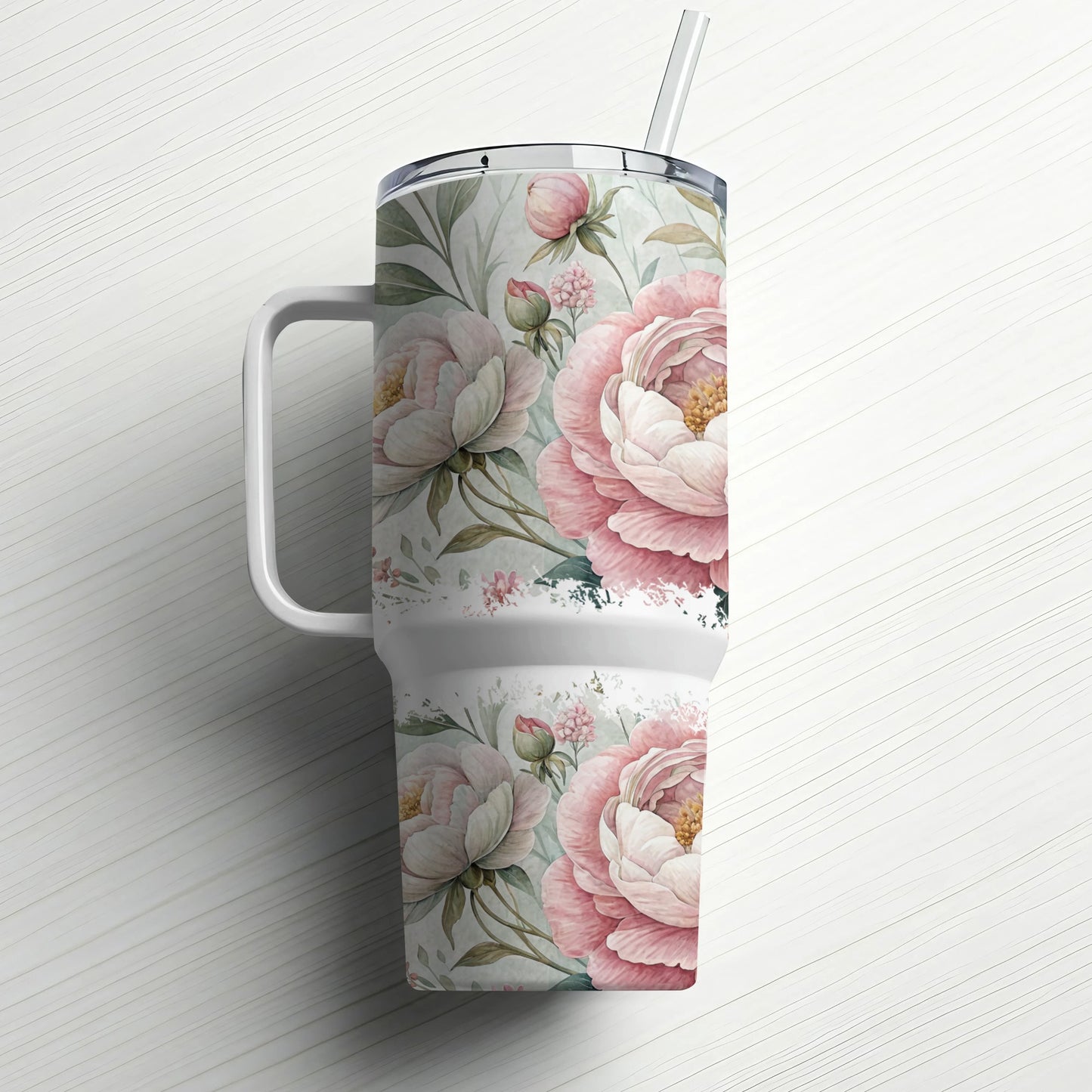 Pink peony floral pattern on a large white tumbler with handle and straw.