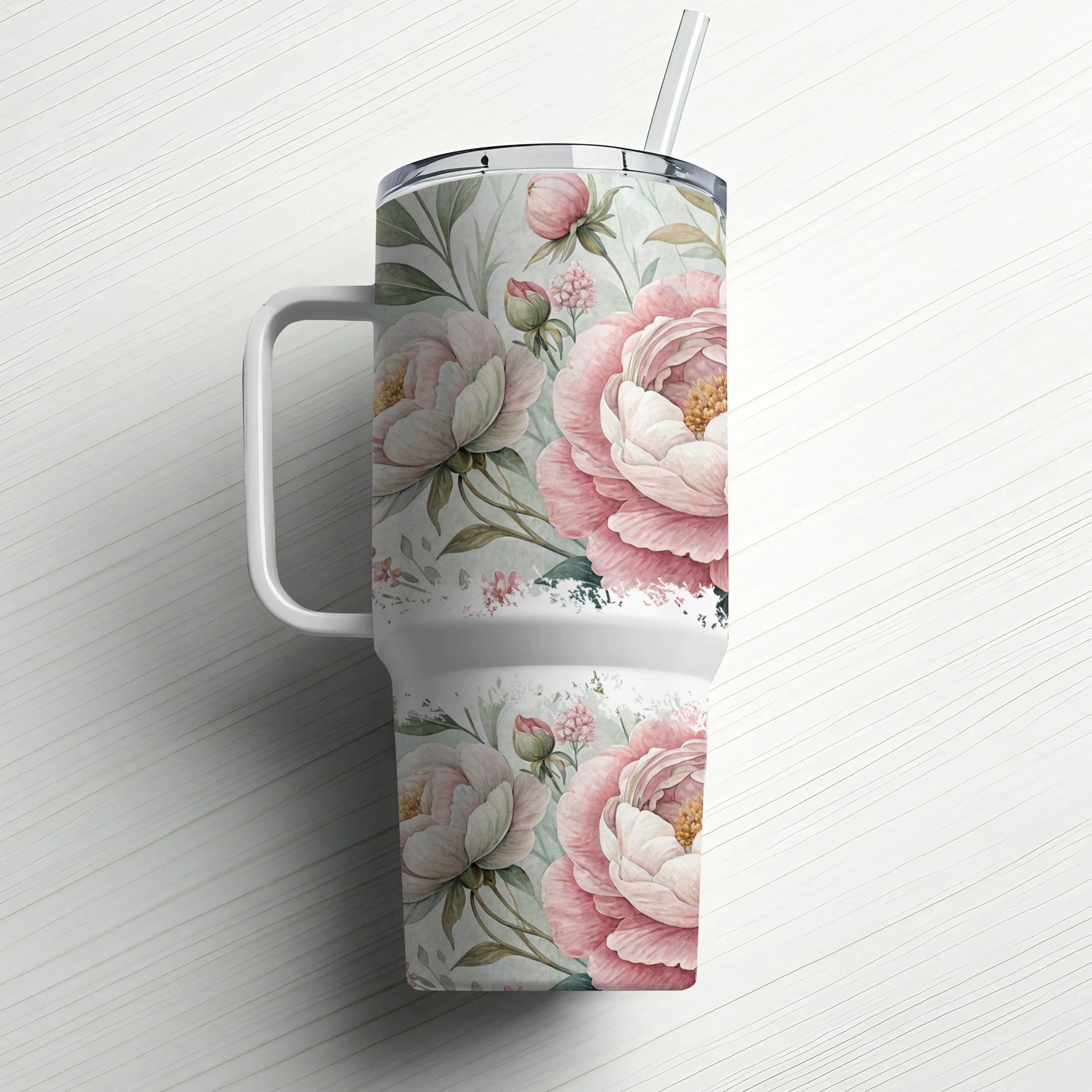 Pink peony floral pattern on a large white tumbler with handle and straw.