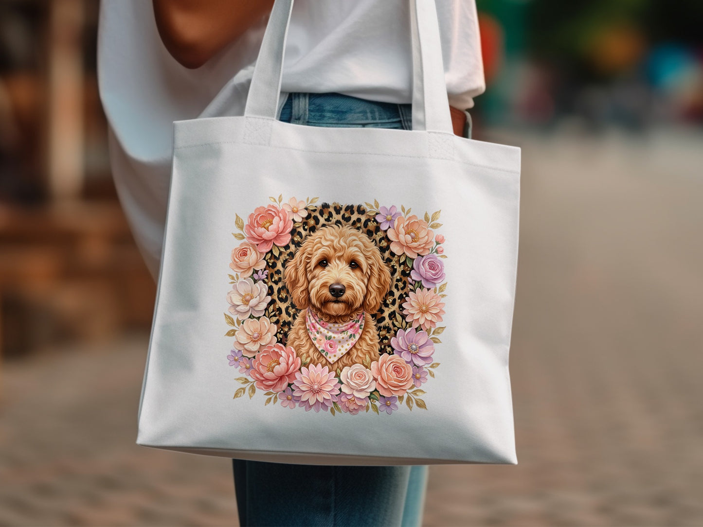 White tote bag with a floral wreath framing a dog wearing a bandana.