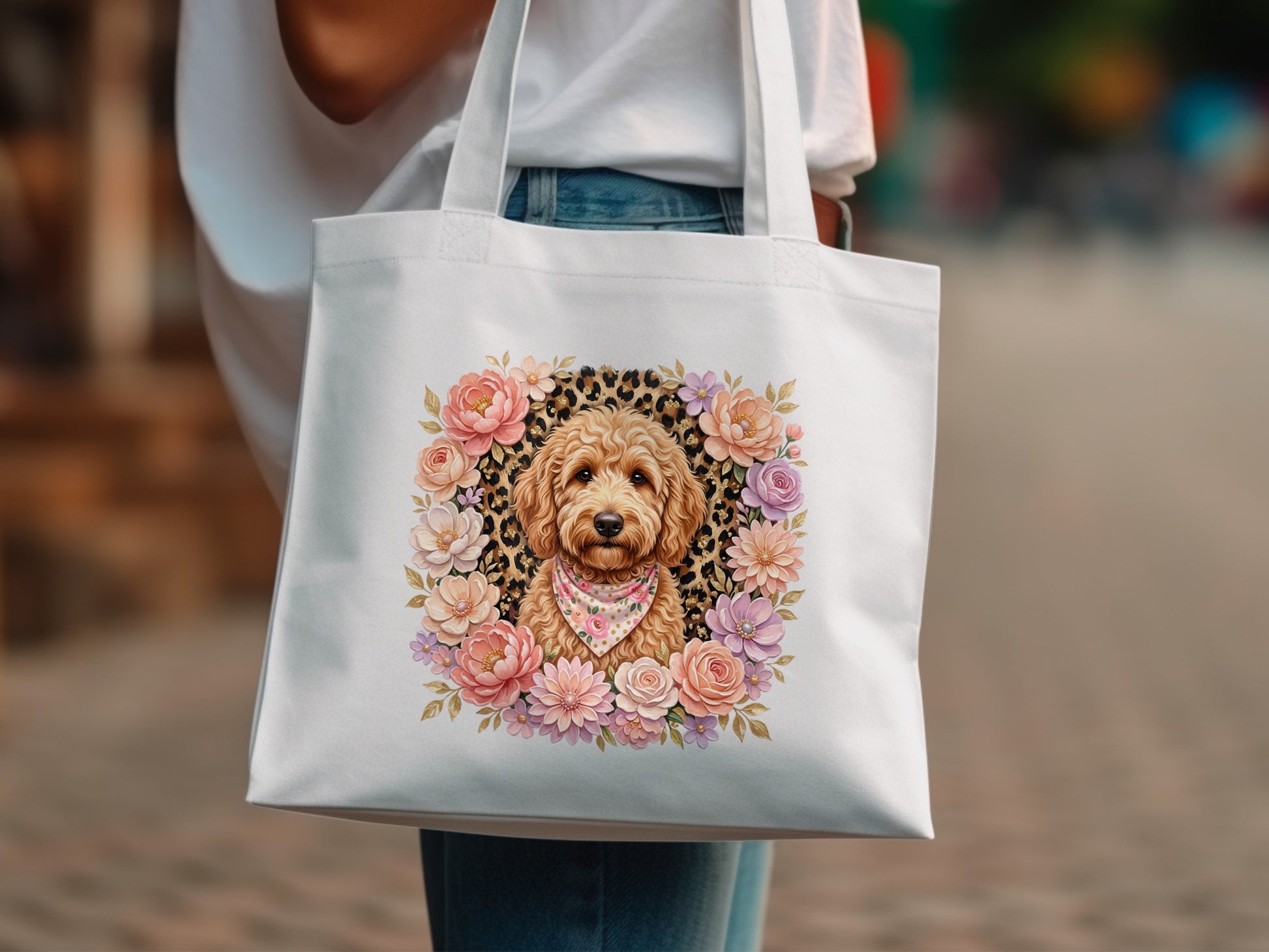 White tote bag with a floral wreath framing a dog wearing a bandana.