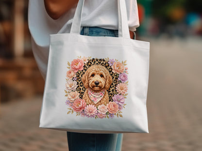 White tote bag with a floral wreath framing a dog wearing a bandana.