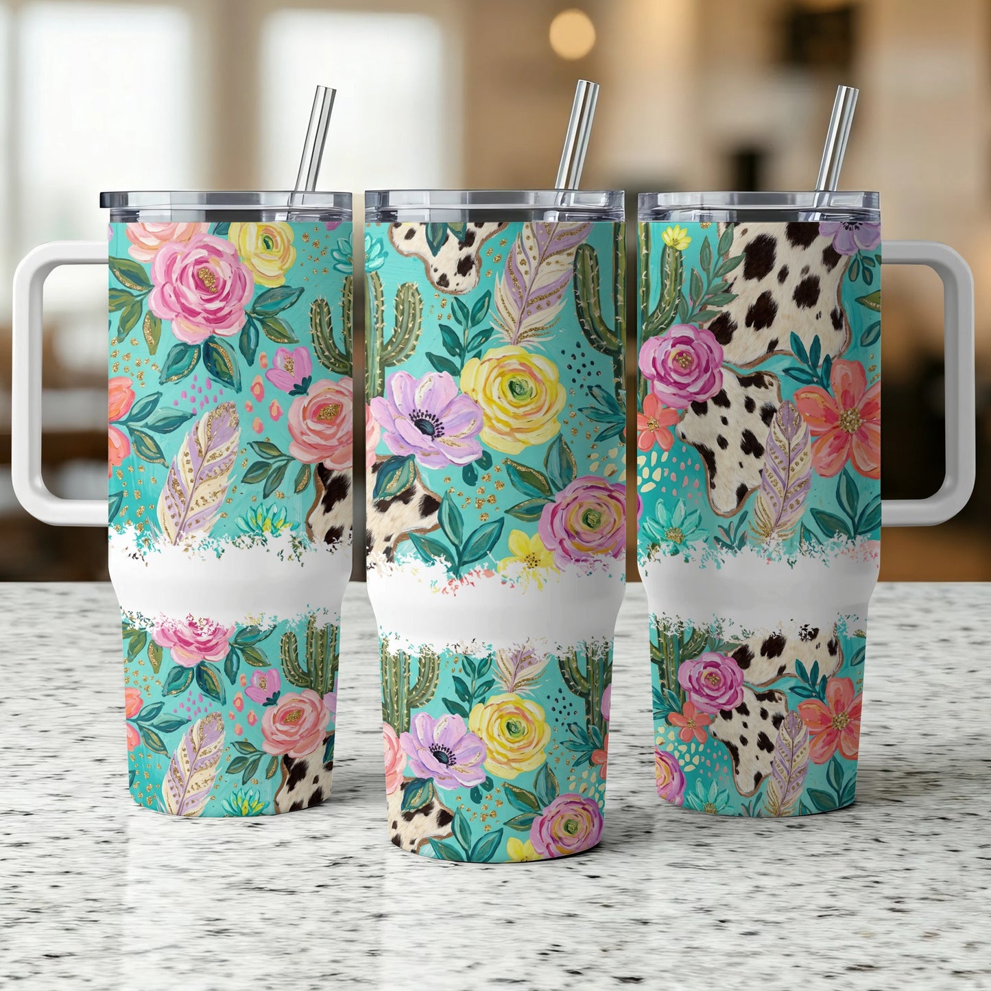 Three tumblers with floral, cactus, and cowhide patterns and white handles.