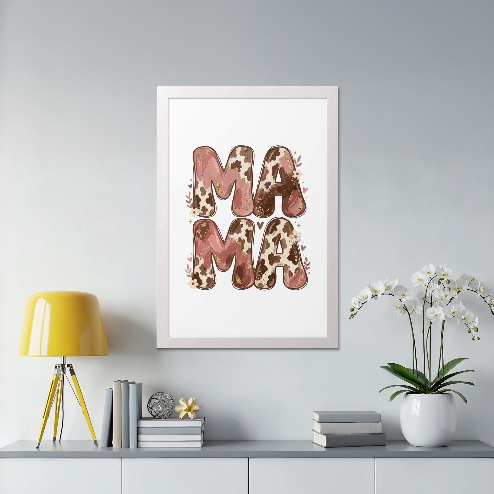 Framed artwork with "MAMA" in cow print and floral accents.