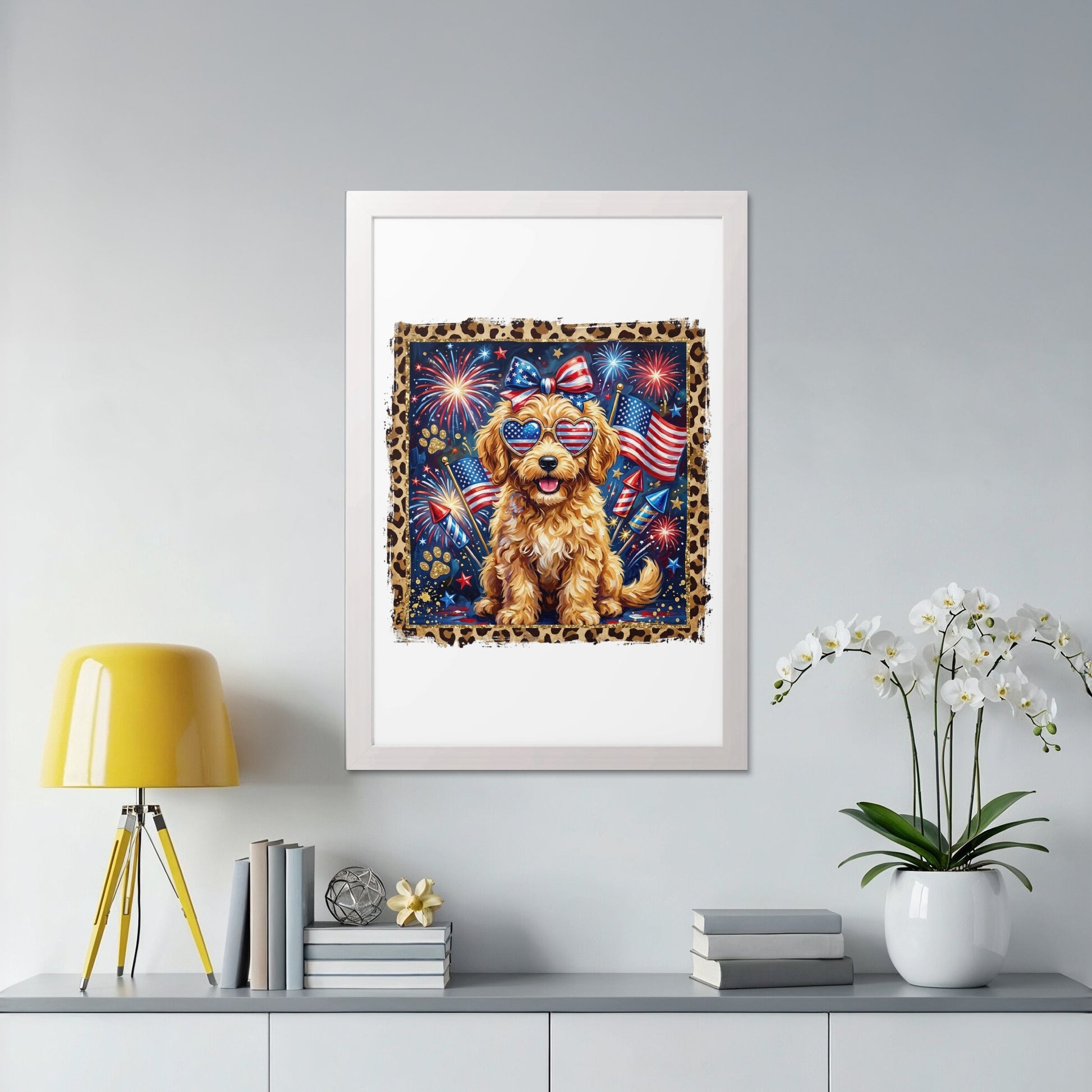 Golden doodle dog wearing American flag sunglasses, confetti, and a bow in a framed print.