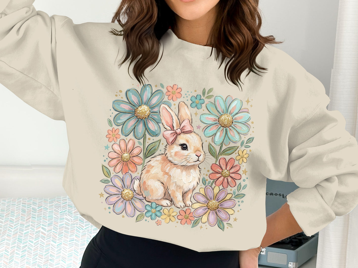 Cream sweatshirt with a pastel floral bunny graphic.