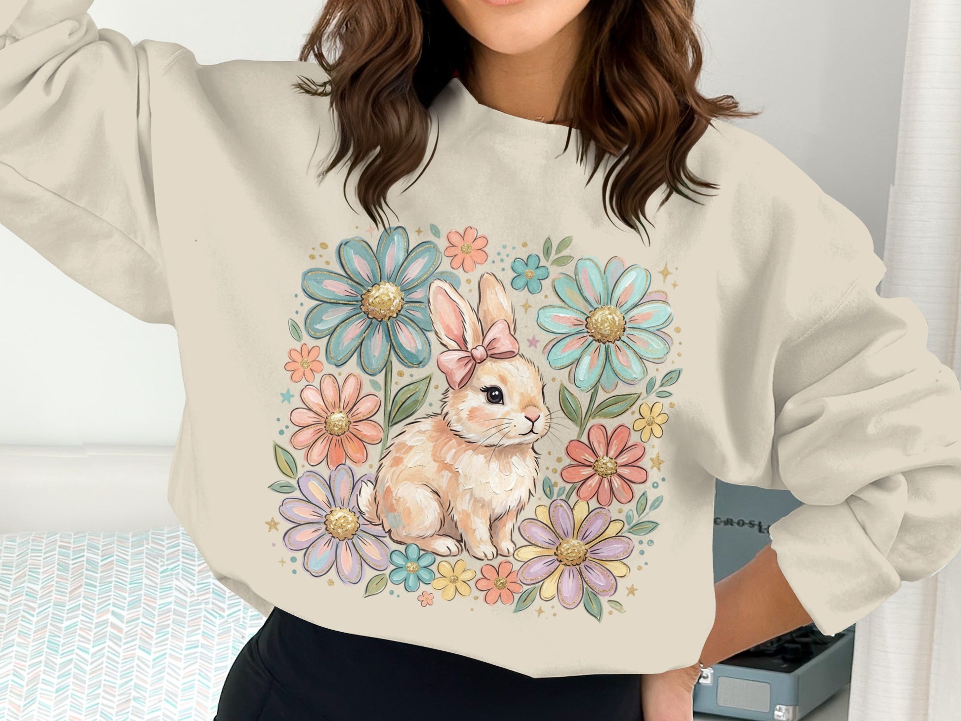 Cream sweatshirt with a pastel floral bunny graphic.