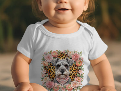 Baby wearing white bodysuit with schnauzer and floral print.