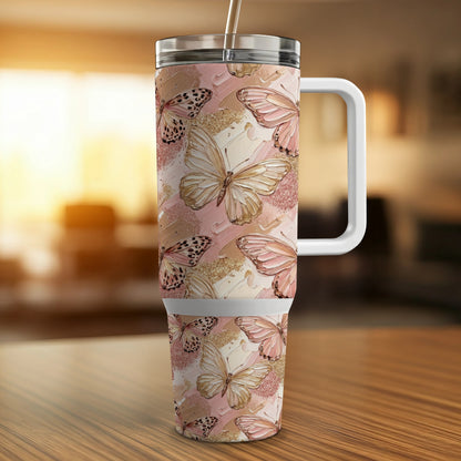 30 oz tumbler with a pink, gold, and white butterfly pattern.