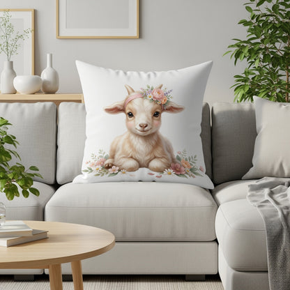 Baby goat wearing a flower crown on a pillow.