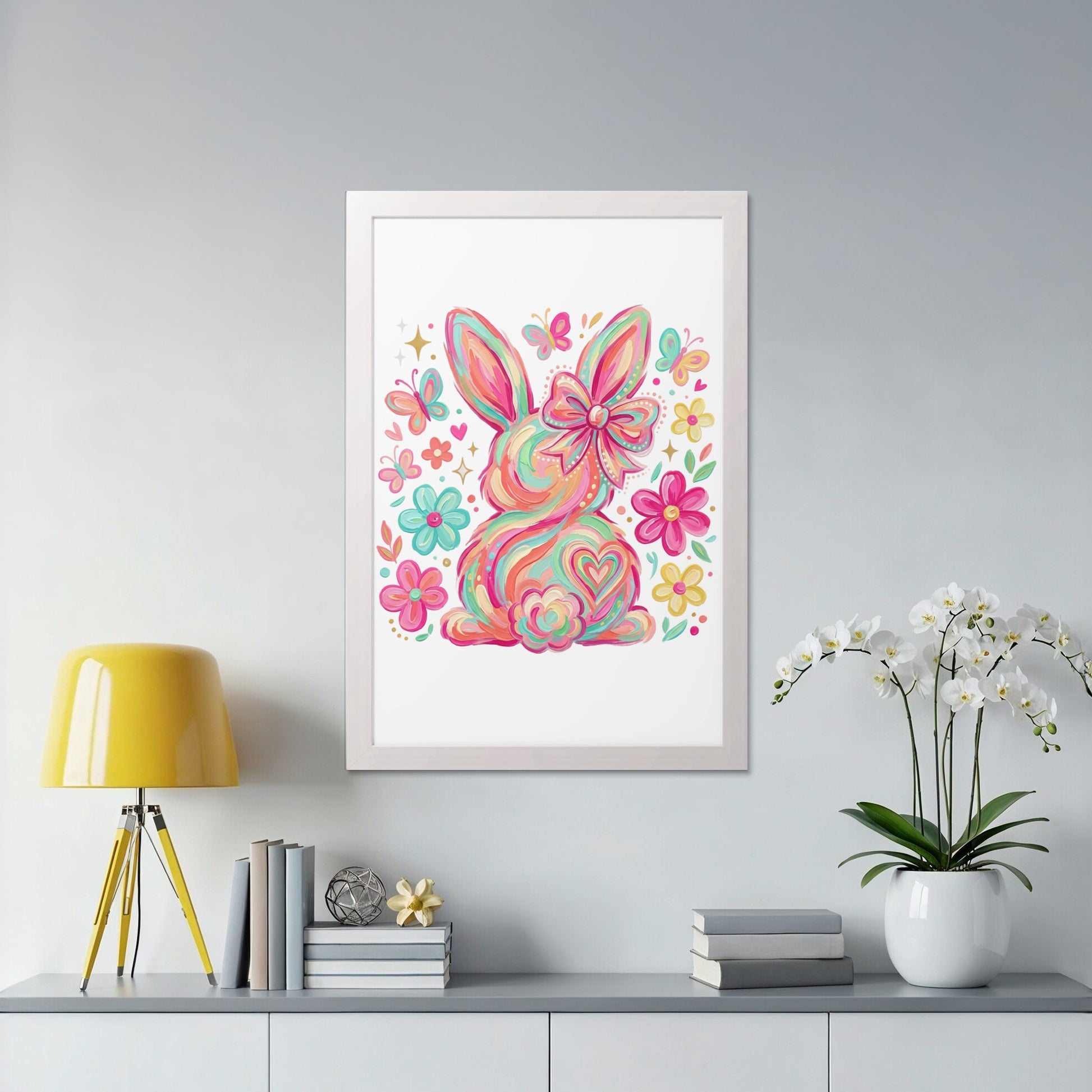 Colorful bunny illustration with butterflies and flowers, framed on a wall.