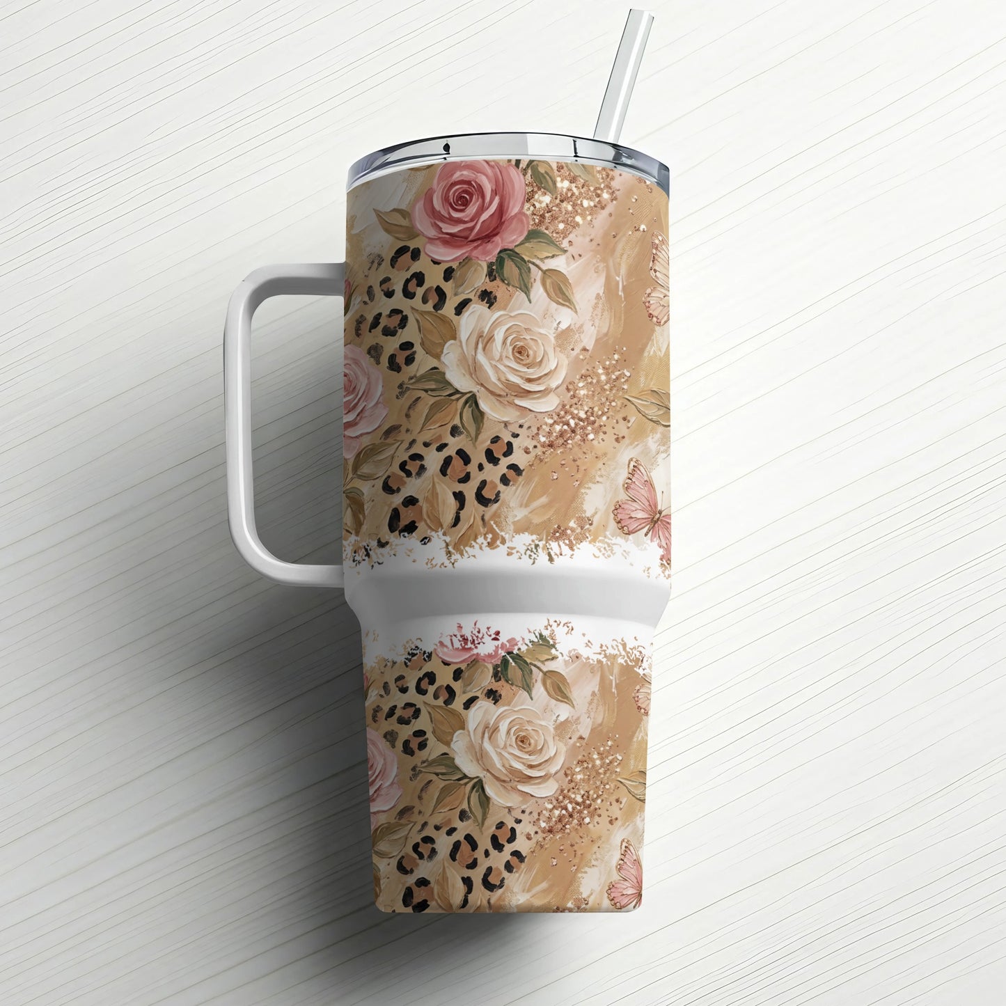 Floral leopard print tumbler with straw and handle.