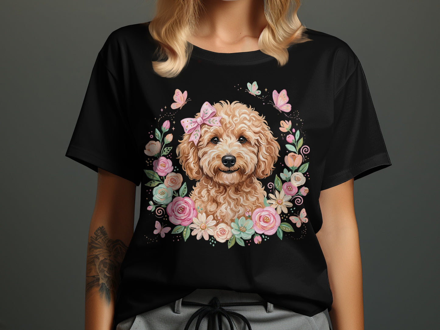 Black t-shirt with cute dog surrounded by flowers and butterflies.