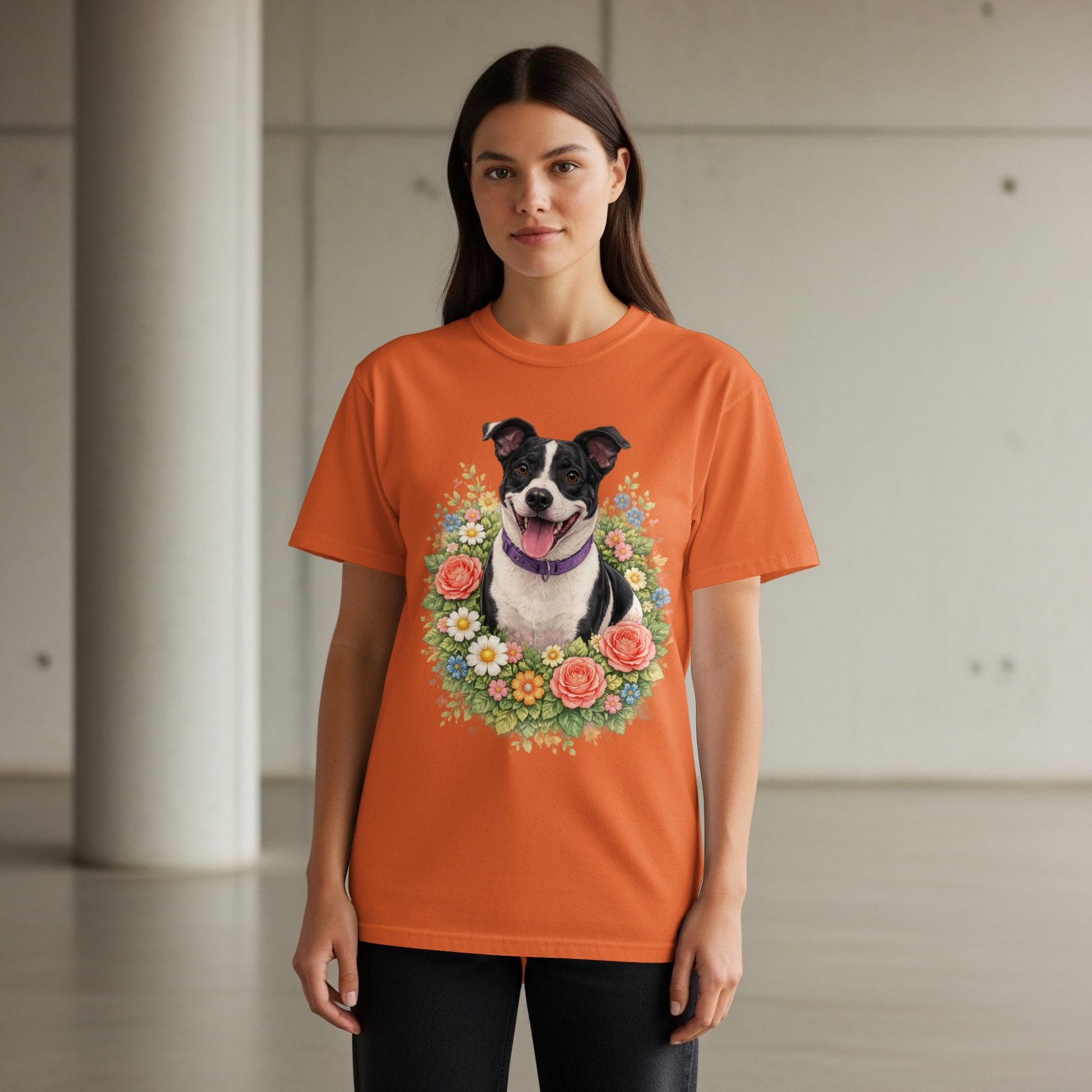 Orange t-shirt with a portrait of a dog in a floral wreath.