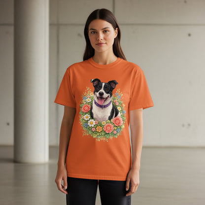 Orange t-shirt with a portrait of a dog in a floral wreath.