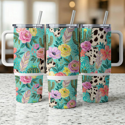 Three tumblers with floral, cactus, and cow print designs.