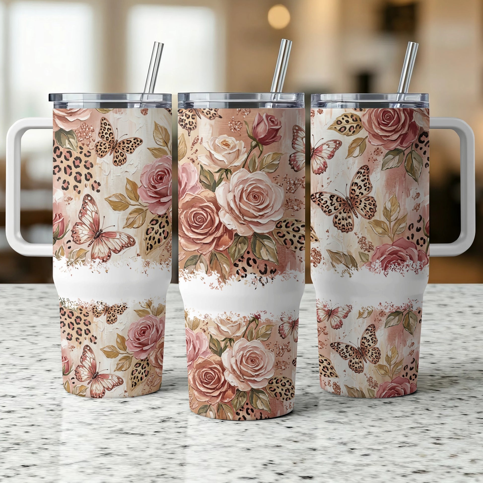 Three tumblers with floral, leopard, and butterfly designs.
