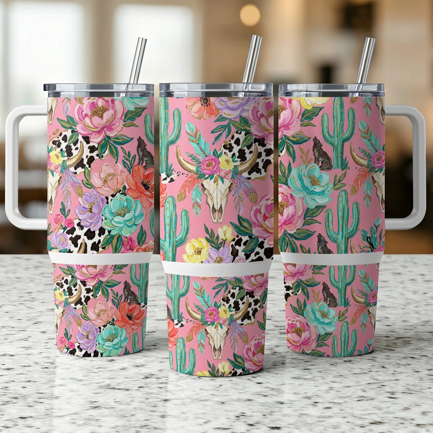 Pink tumbler with cow skull, cactus, and floral design, three views.
