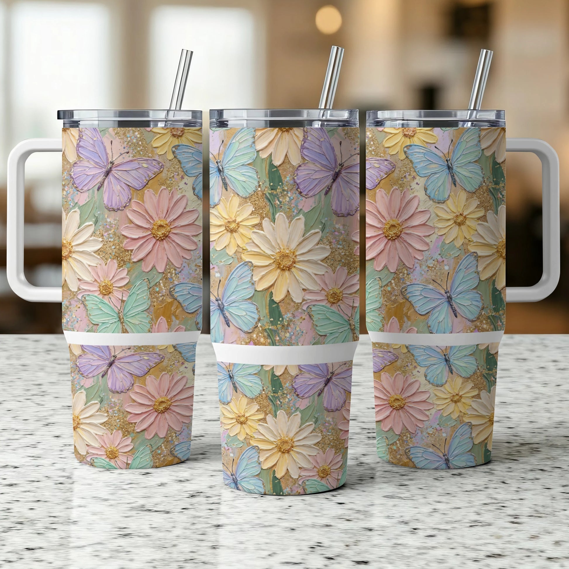 Three tumblers with pastel butterflies and floral designs.