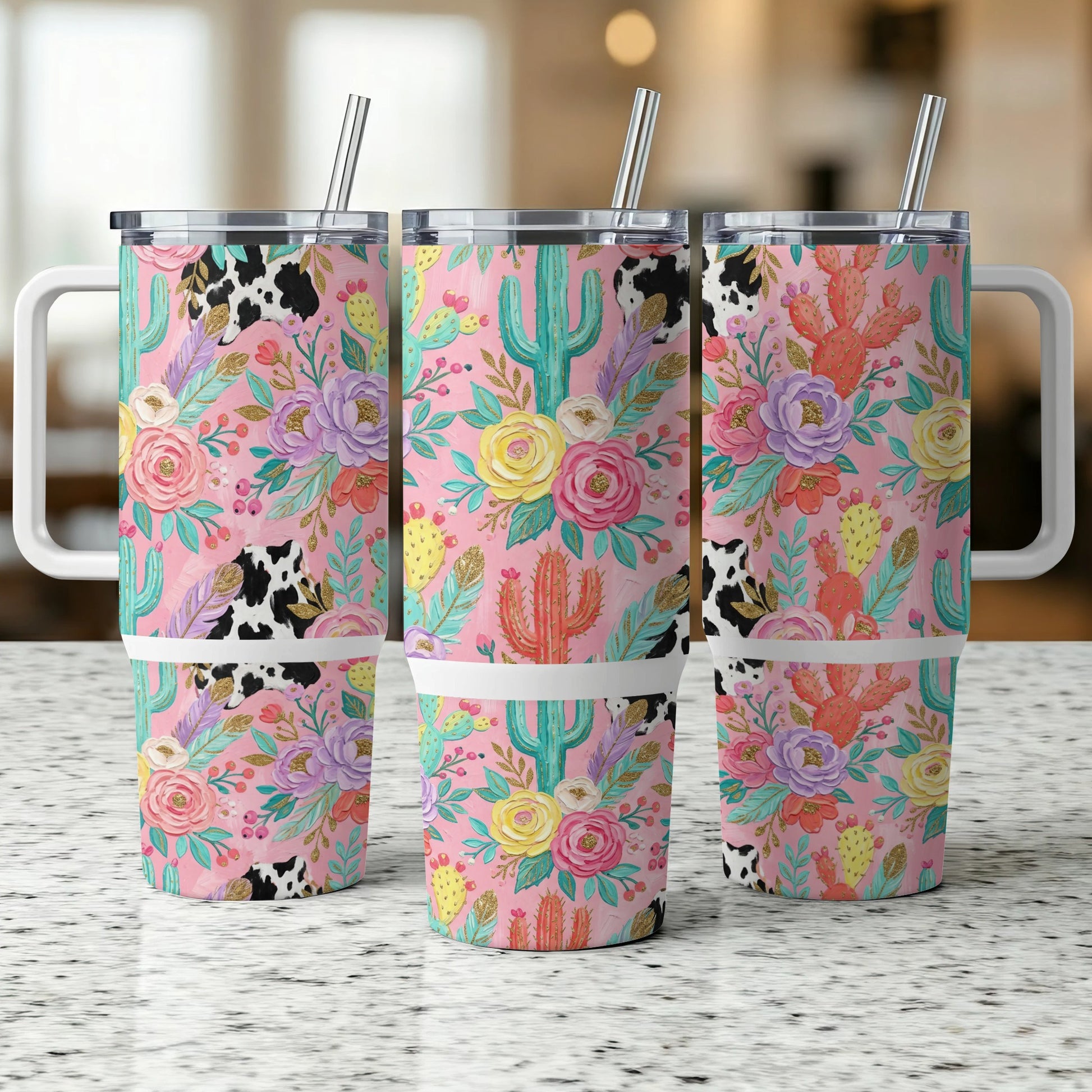 Pink tumbler with cow print and floral cactus design.