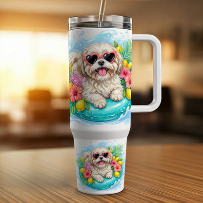 White tumbler with a dog in sunglasses on a float and tropical flowers.