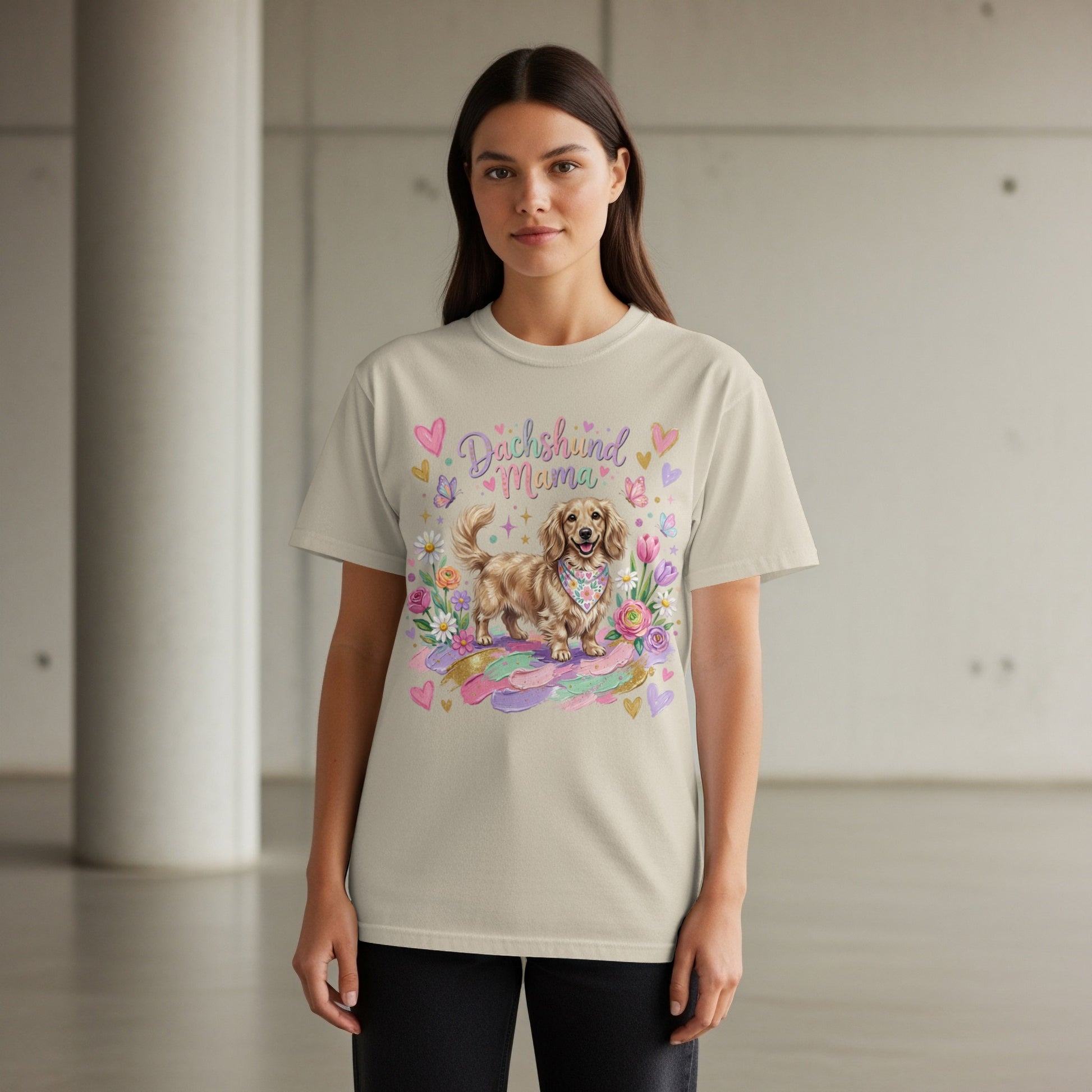 Light beige t-shirt with a dachshund wearing a bandana surrounded by flowers and hearts.