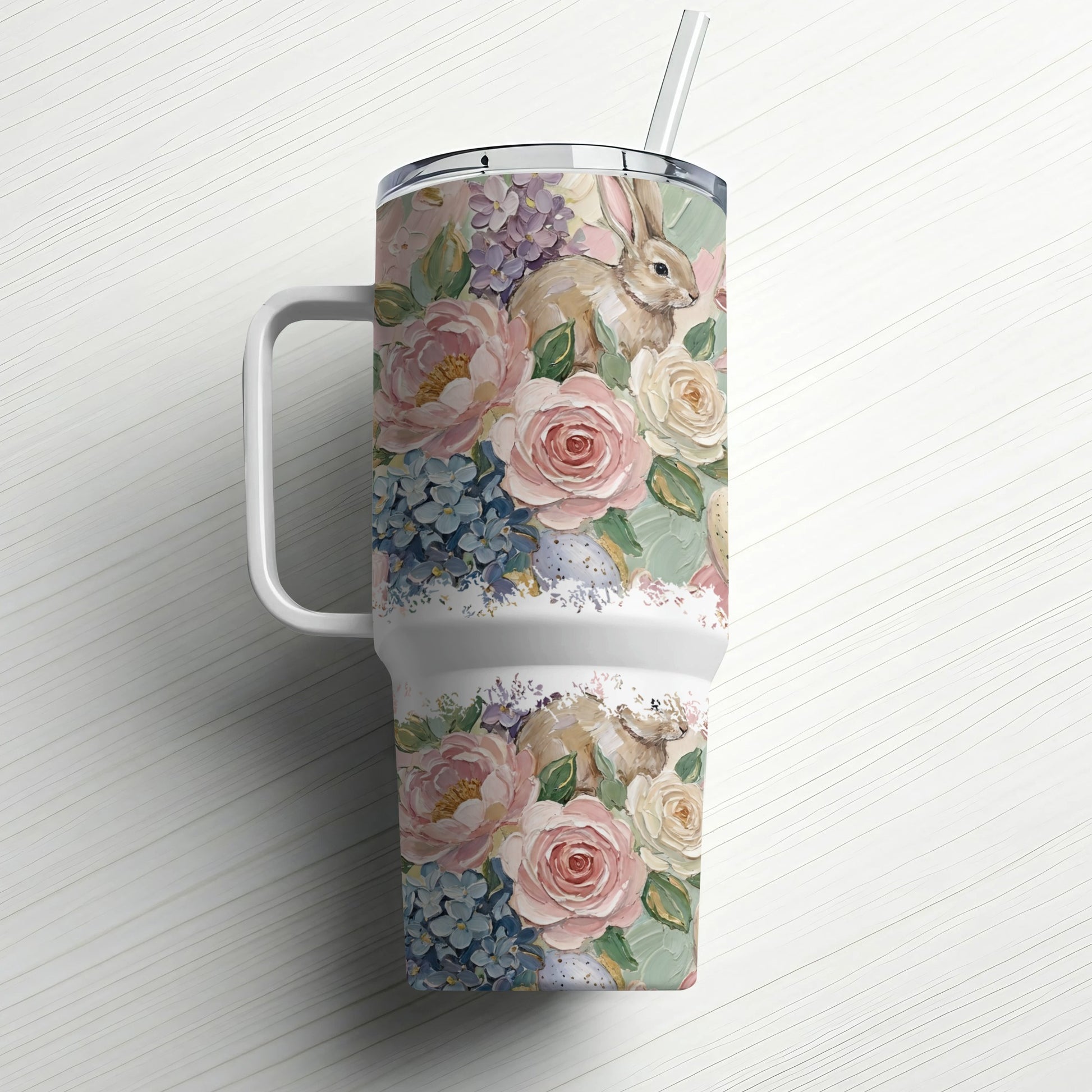 Floral tumbler with bunny and Easter eggs and straw.