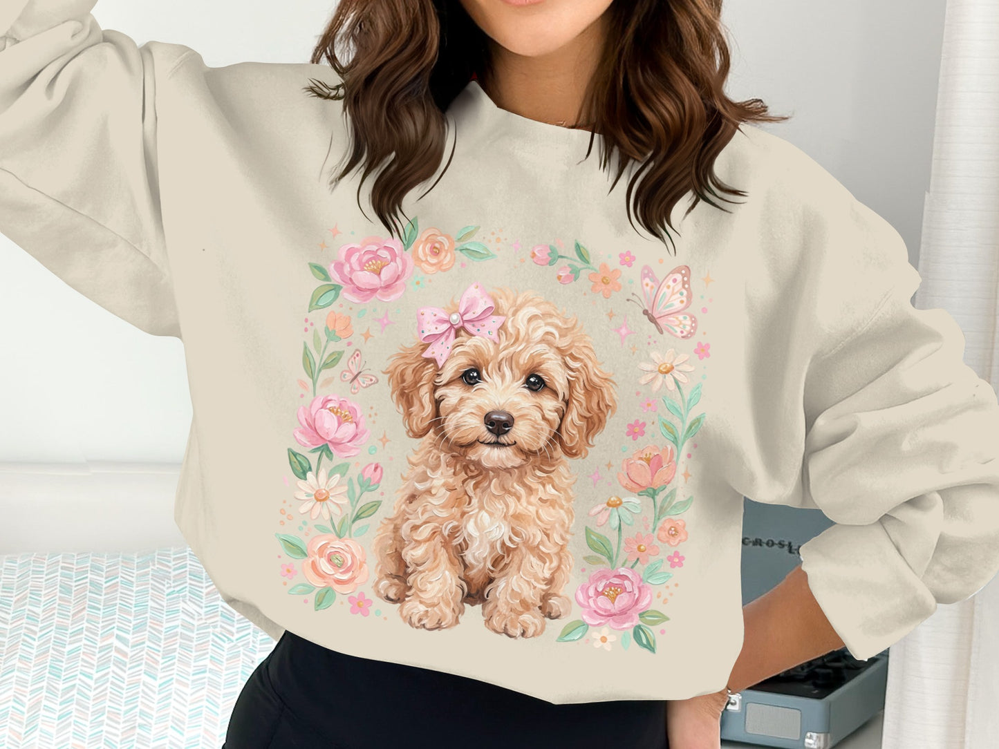 Cream sweatshirt with a cartoon puppy and floral border.