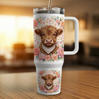 Highland cow with flowers on a floral-patterned tumbler.