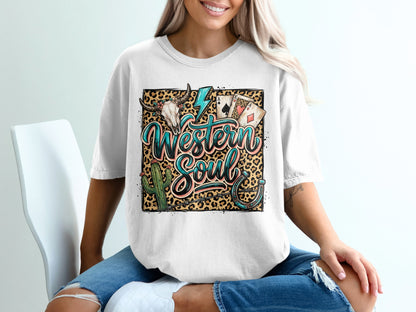 White t-shirt with "Western Soul" text, bull skull, cactus, lightning, and playing cards.