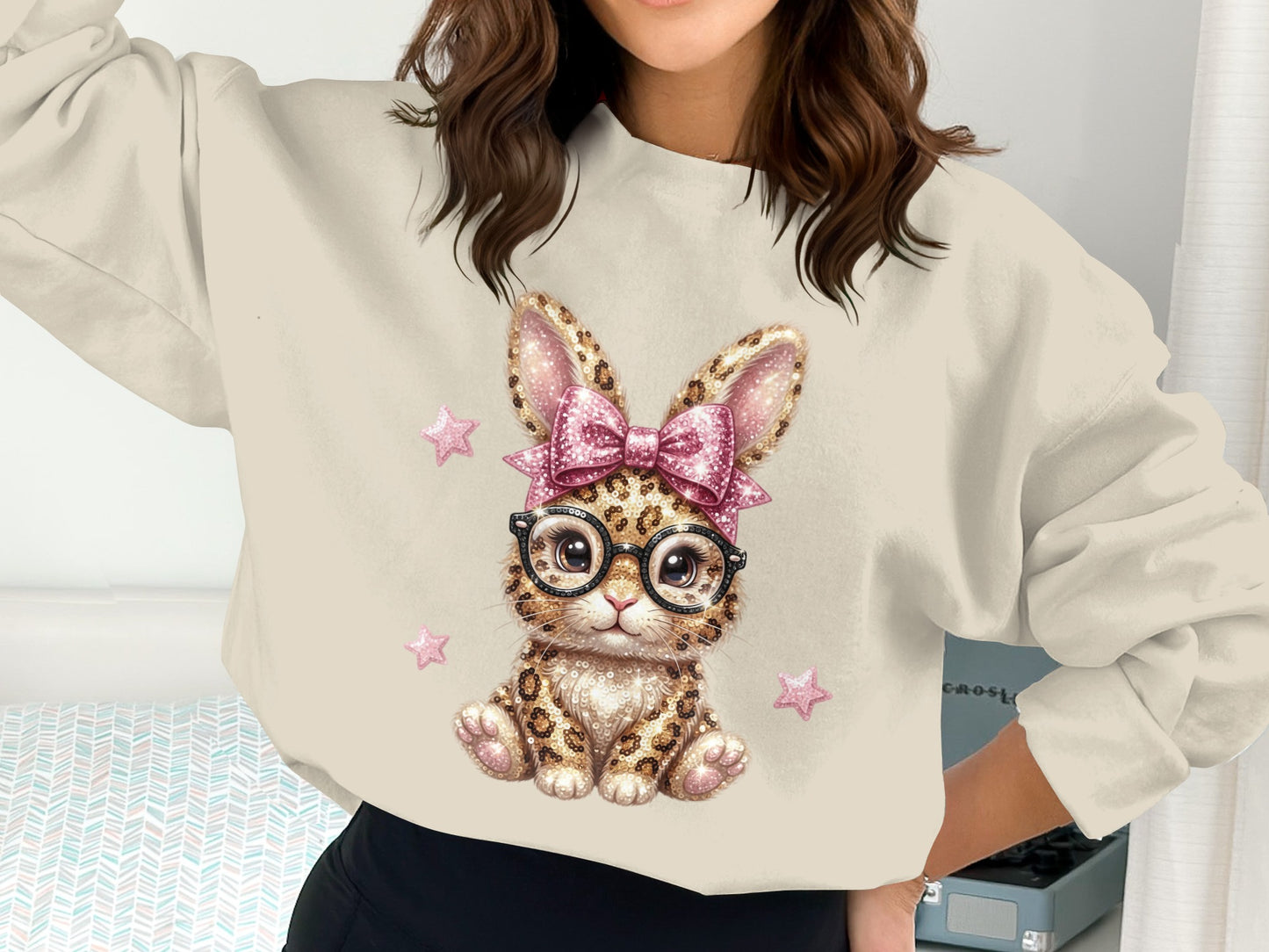 Sweatshirt with glittery leopard bunny graphic, pink bow, and glasses.