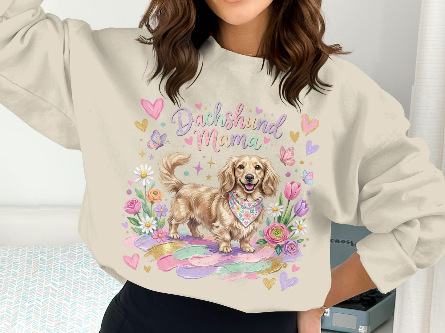 Dachshund Mama graphic sweatshirt with colorful floral and butterfly accents.