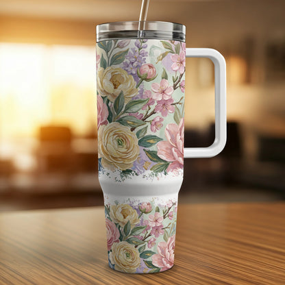 Tall insulated tumbler with a floral pattern of pink and yellow roses.