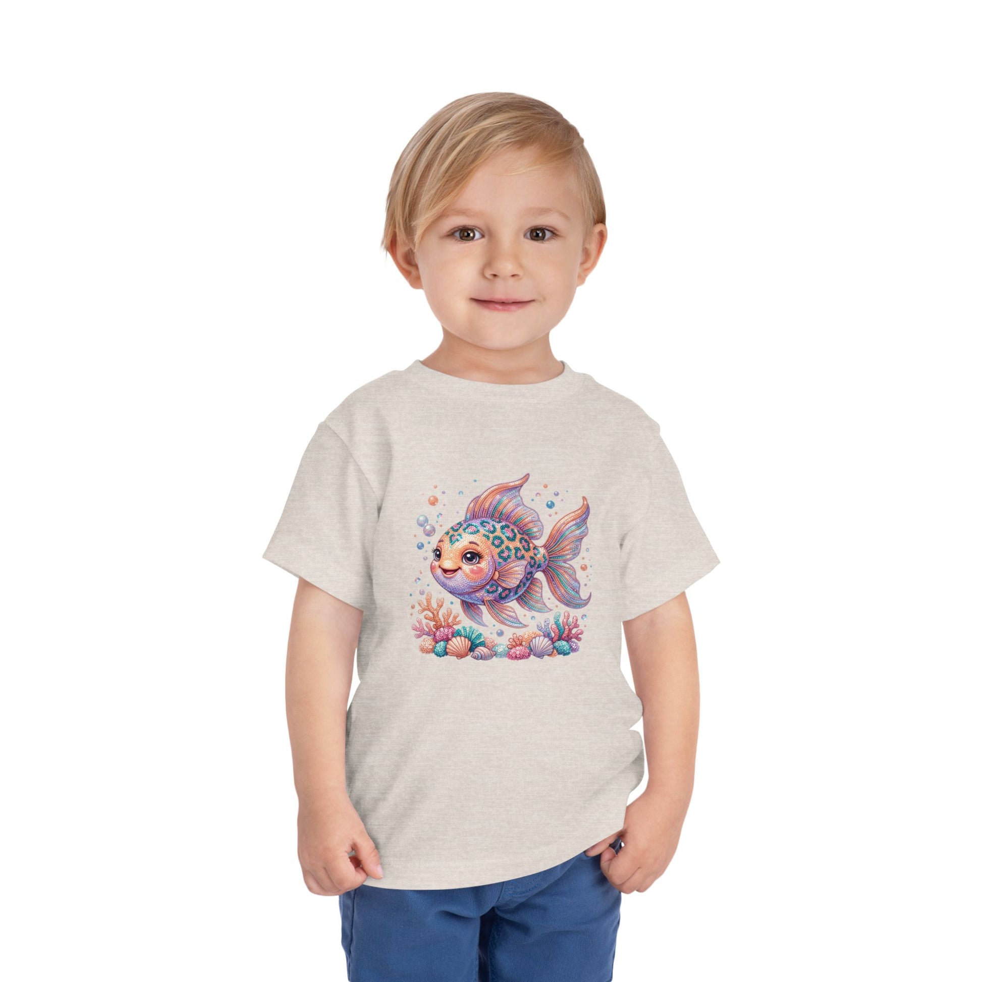 T-shirt featuring a cartoon fish with coral and seashells.
