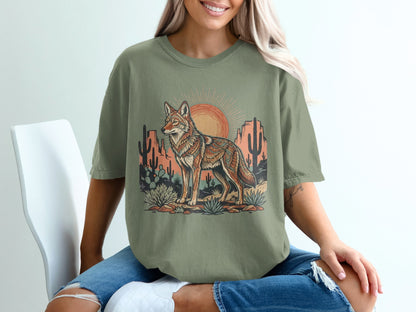 T-shirt with coyote, desert landscape, and sun graphic.