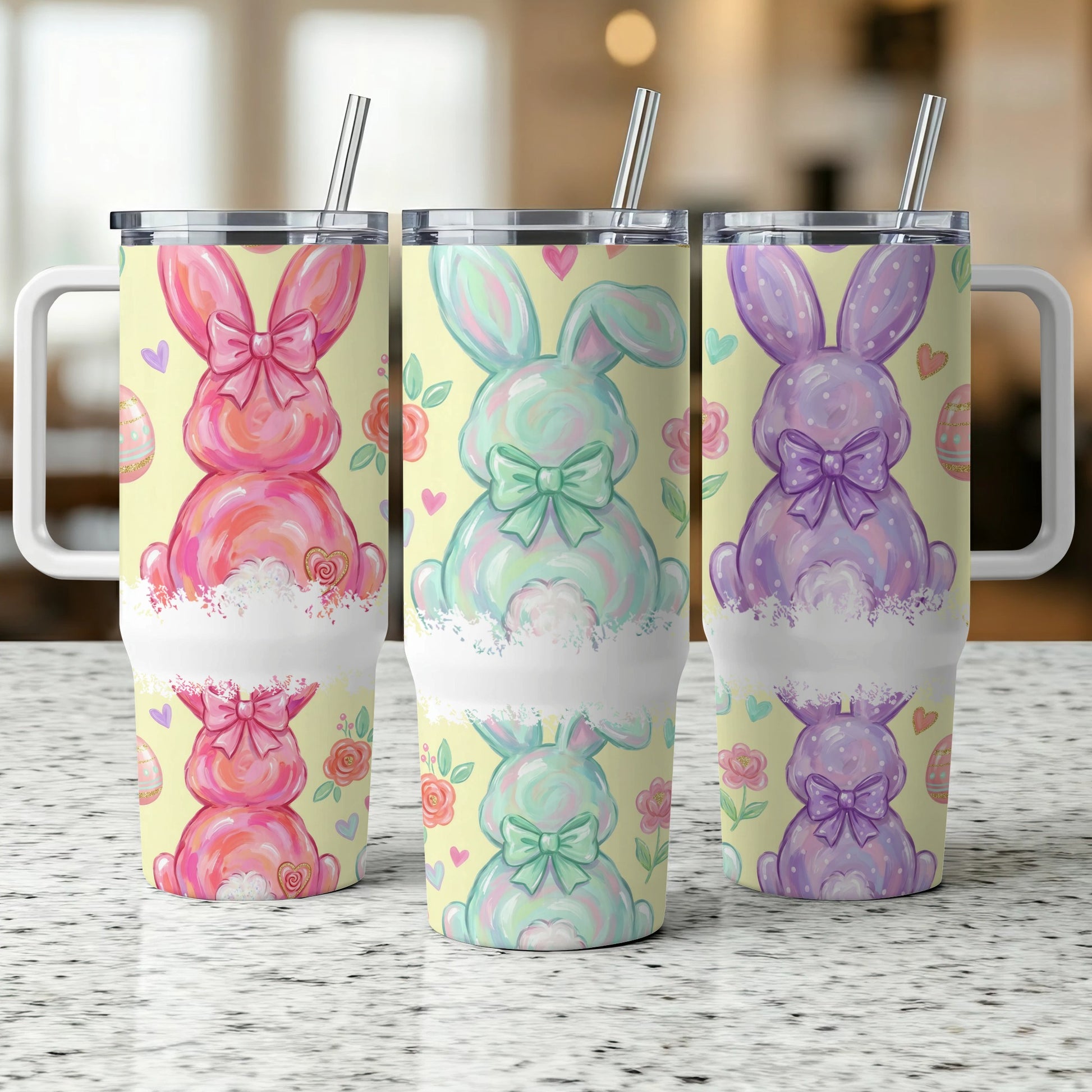 Three Easter bunny tumblers with bows, flowers, and polka dots.