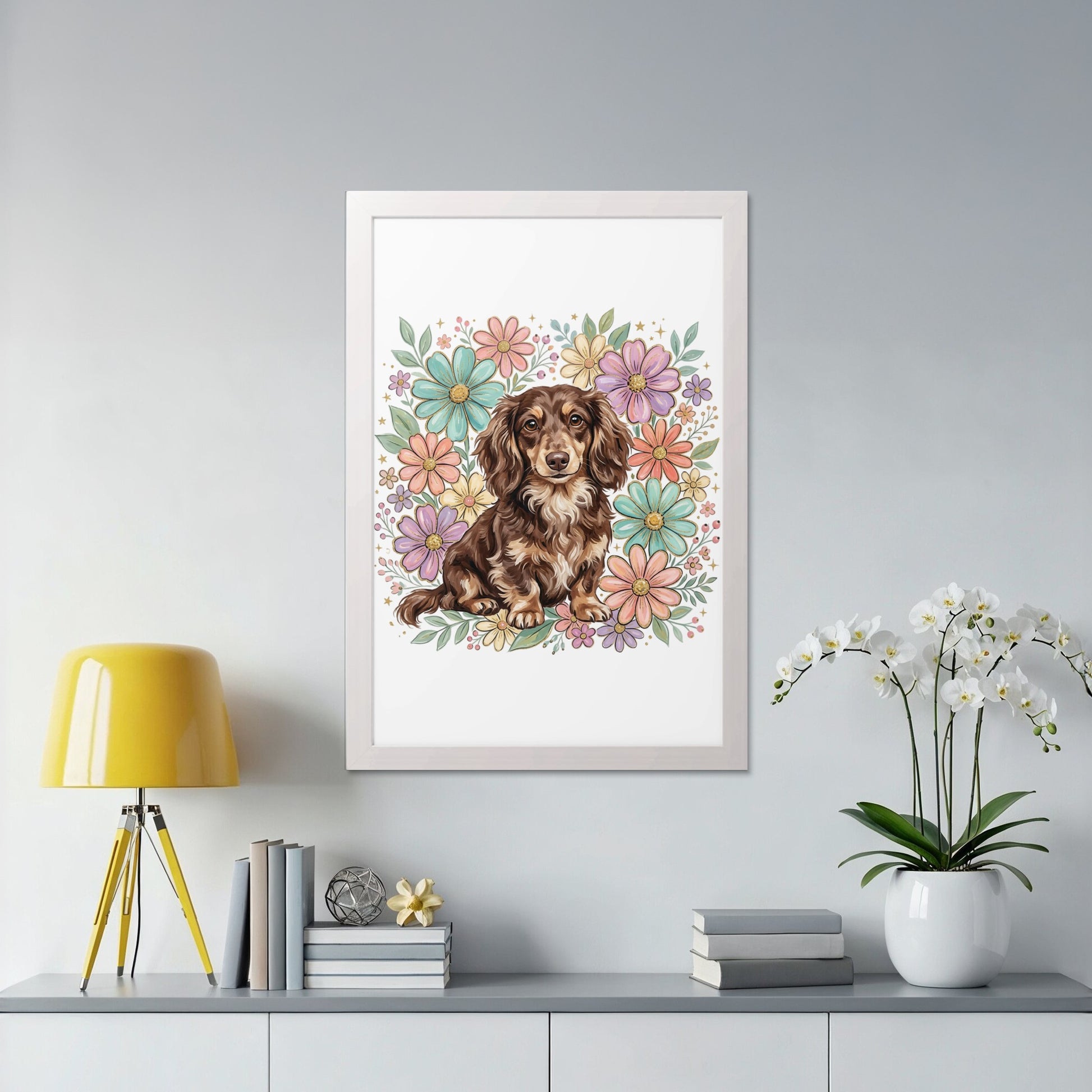 Brown dachshund sitting in front of a floral illustration in a white frame.