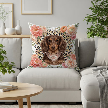 Dachshund wearing bandana on floral and leopard print pillow.