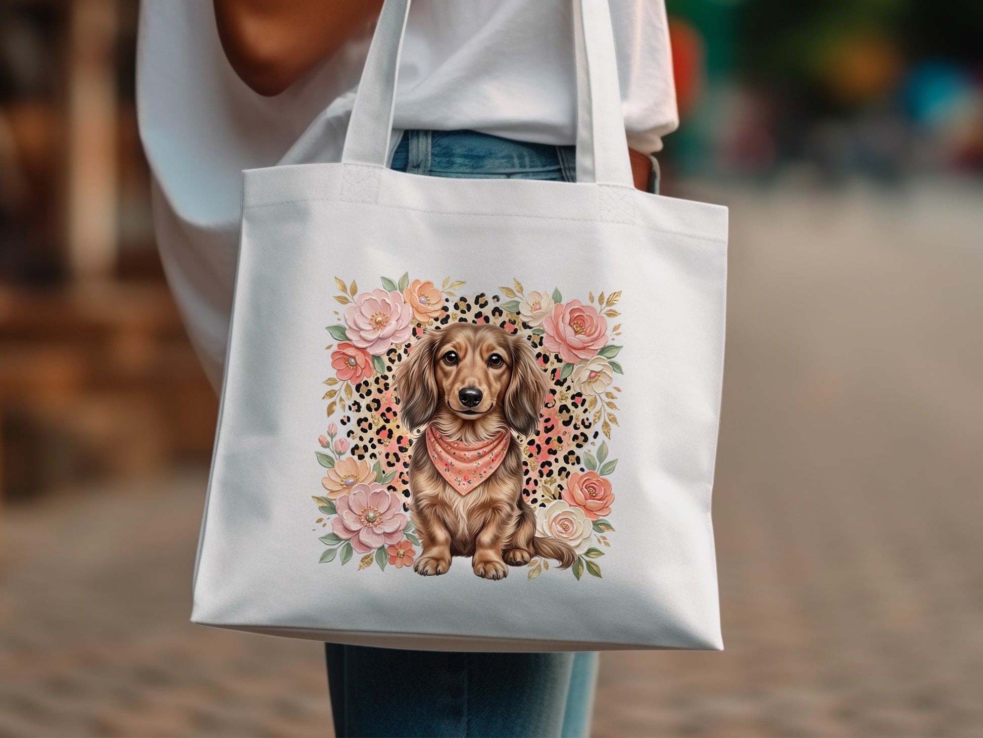 White tote bag with dachshund wearing bandana and floral accents.