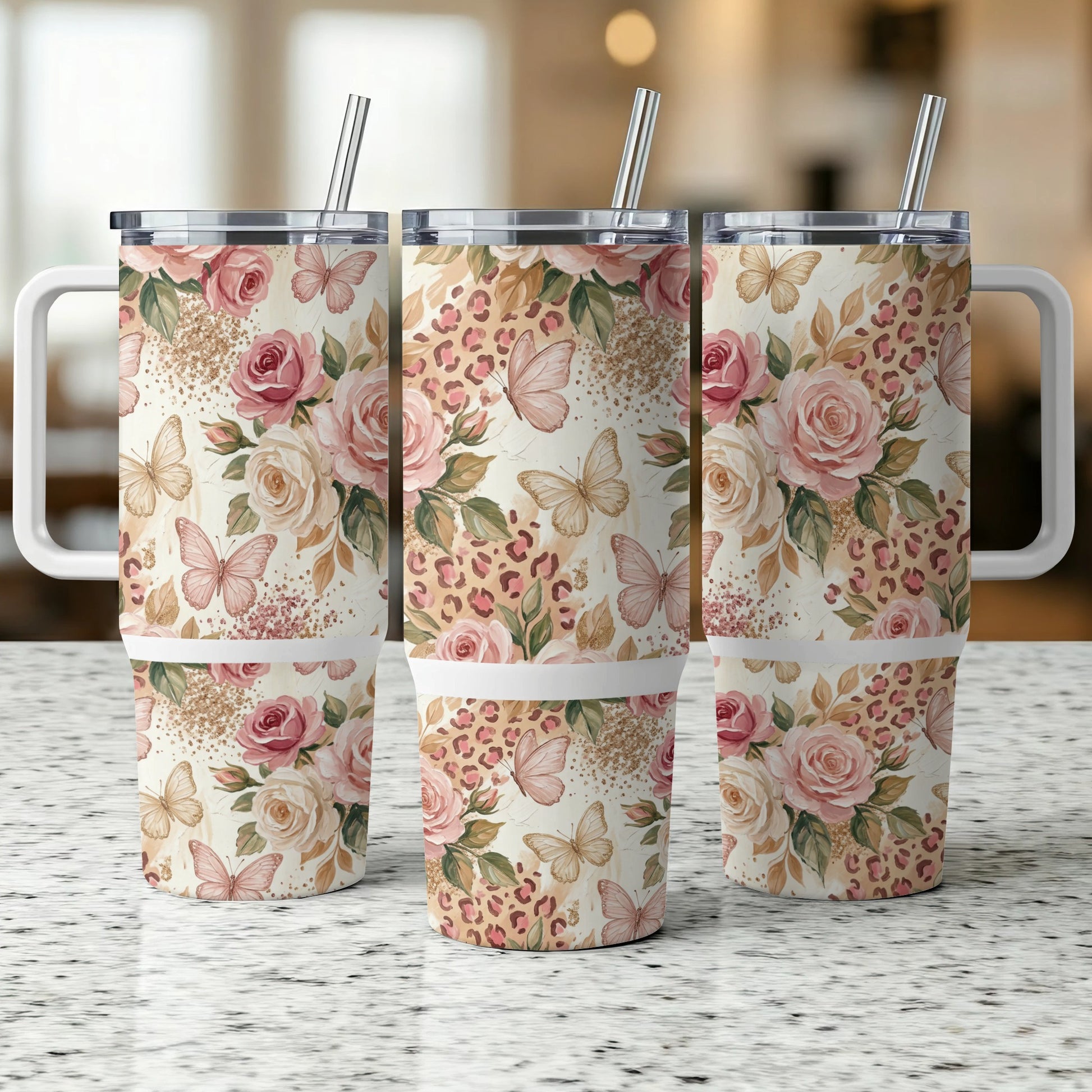 Three tumblers with floral and leopard print patterns and butterflies.