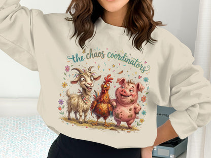 Sweatshirt with "the chaos coordinators" text and cartoon farm animals: pig, chicken, and goat.