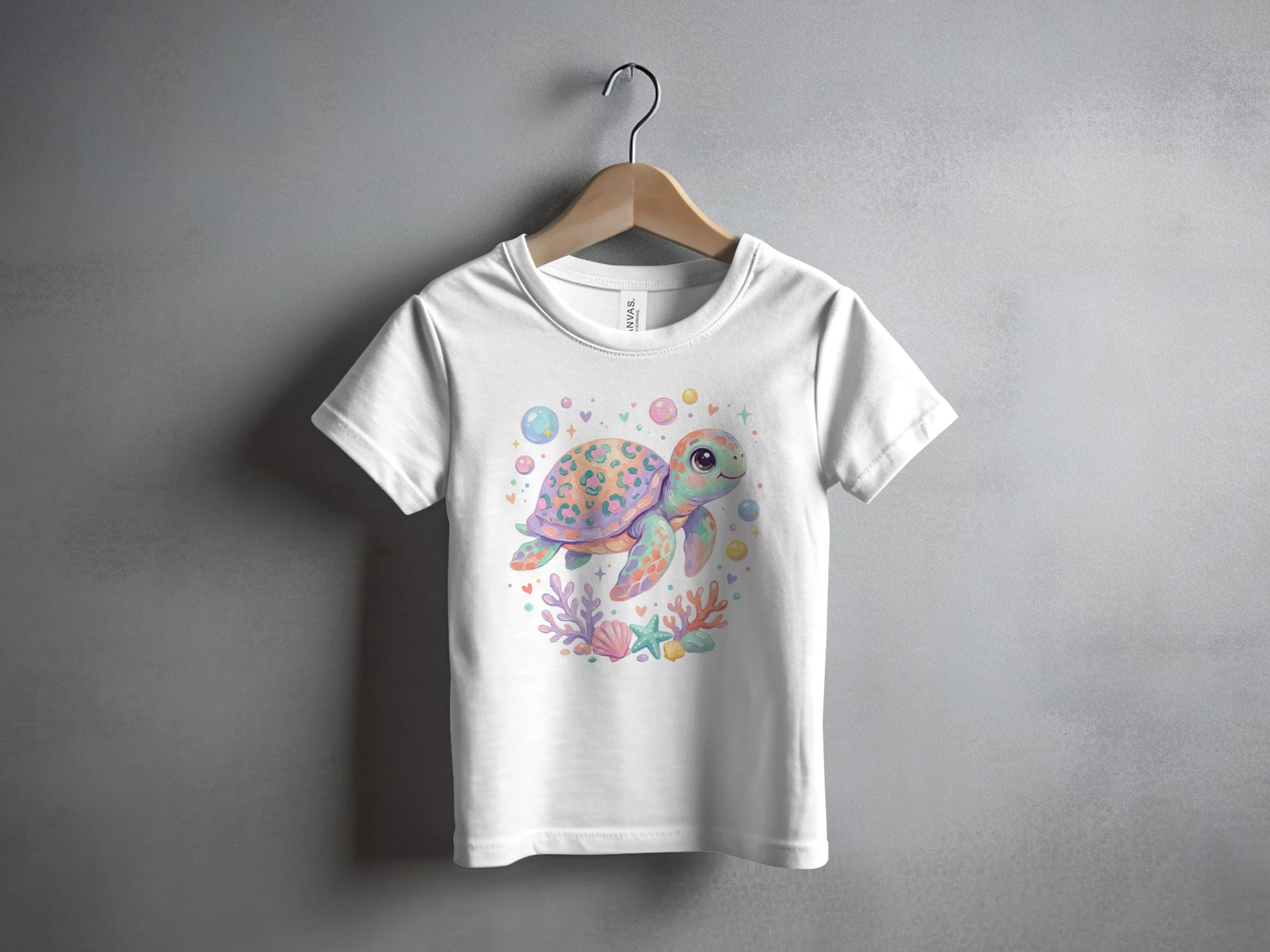 White t-shirt with a watercolor illustration of a playful sea turtle and coral.