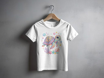 White t-shirt with a watercolor illustration of a playful sea turtle and coral.