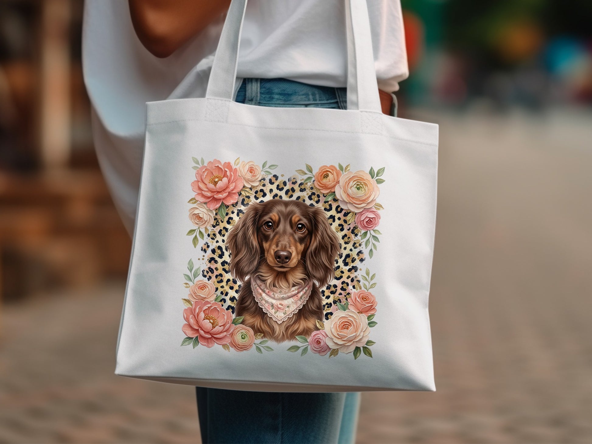 White tote bag with a detailed illustration of a dachshund wearing a bandana surrounded by roses.