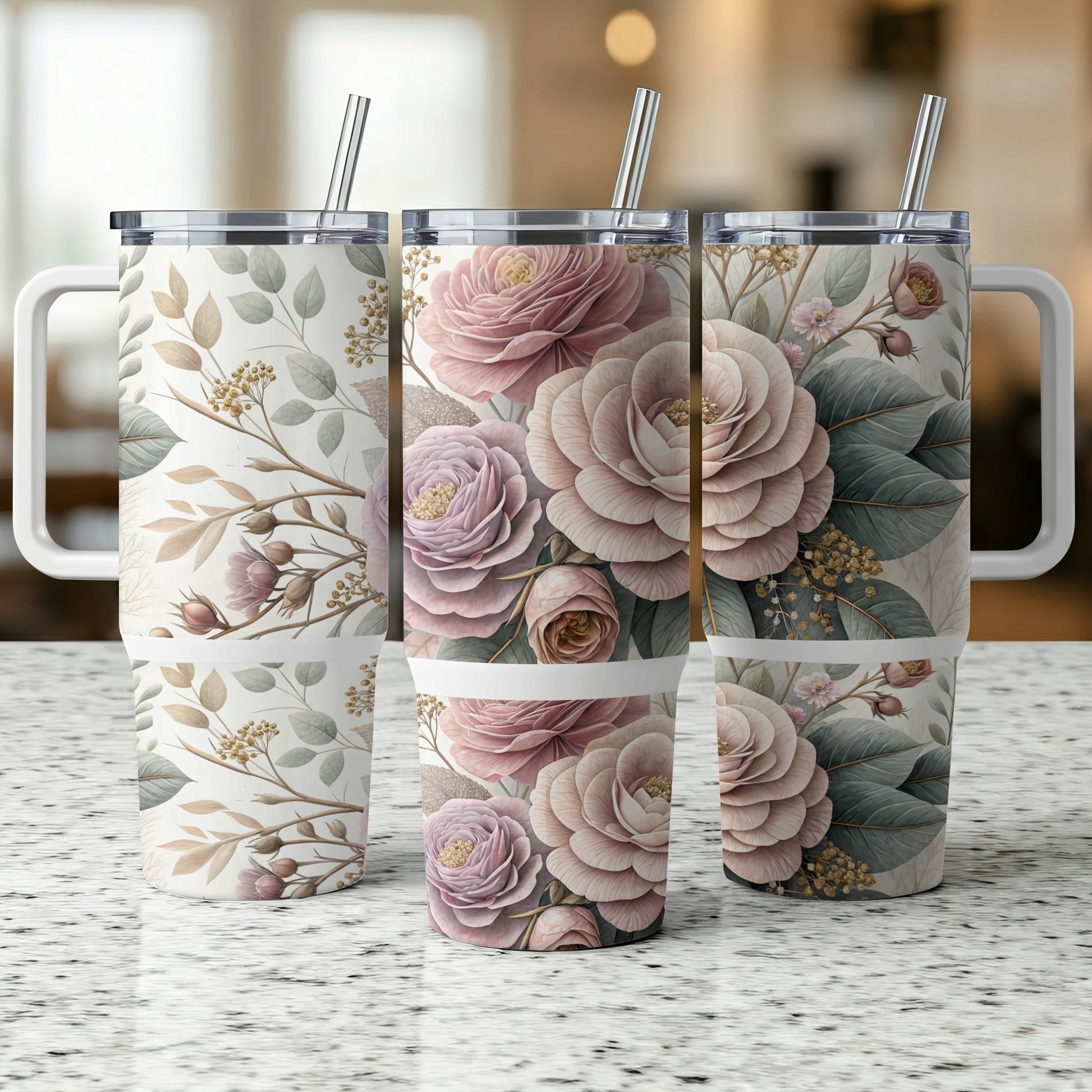 Three stainless steel tumblers with a floral pattern and straws.